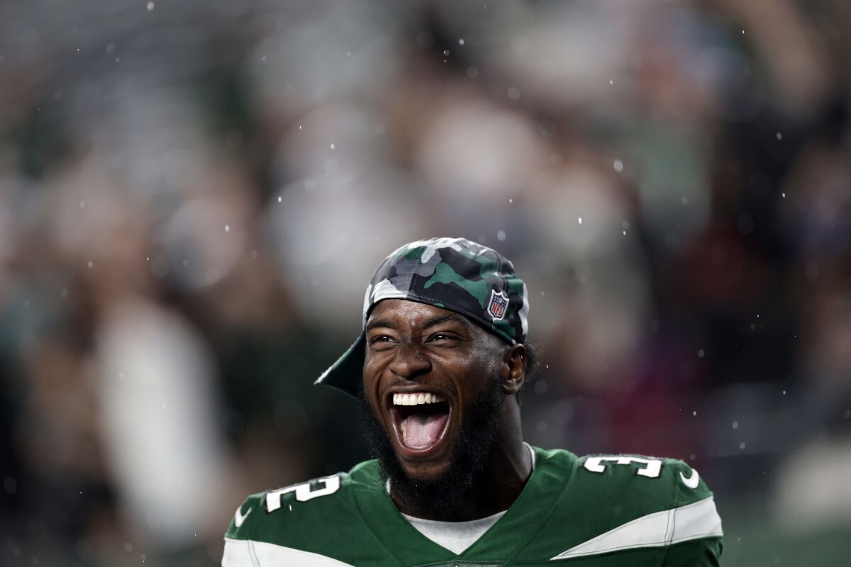 New York Jets running back Michael Carter (32) reacts against the Atlanta Falcons during a preseason NFL football game Monday, Aug. 22, 2022, in East Rutherford, N.J. (AP Photo/Adam Hunger)