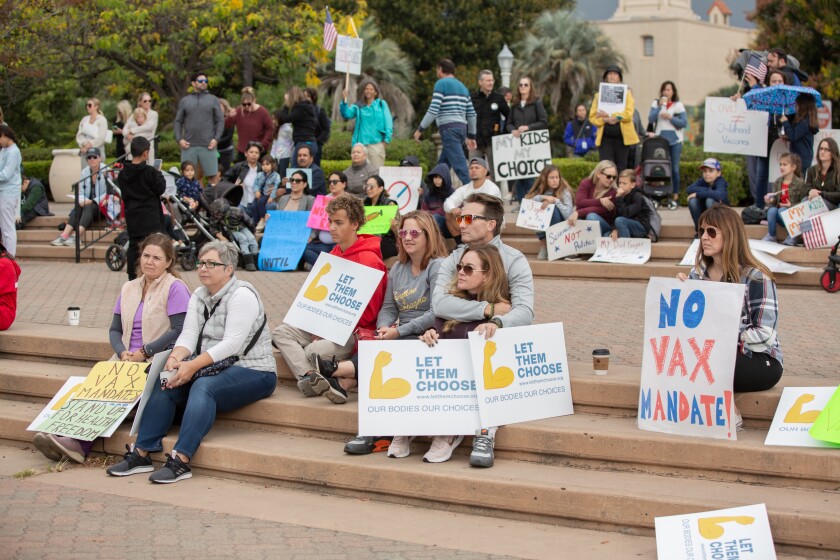 Teachers, parents and students stage a sit out to protest vaccine mandates in Balboa Park.