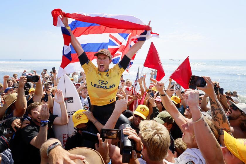 SAN CLEMENTE, CA SEPT. 6, 2024 - Hawaiii's John John Florence is carried off the sand after beating Brazilian Italo Ferreira during the Lexus WSL Finals at Lower Trestles in San Clemente on September 6, 2024. (Allen J. Schaben / Los Angeles Times)