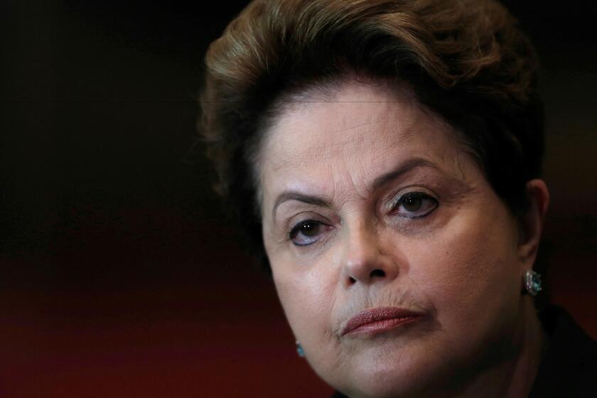 Dilma Rousseff listens to a question during an Oct. 6, 2014, reelection campaign news conference at the Alvorada Palace in Brasilia, Brazil.