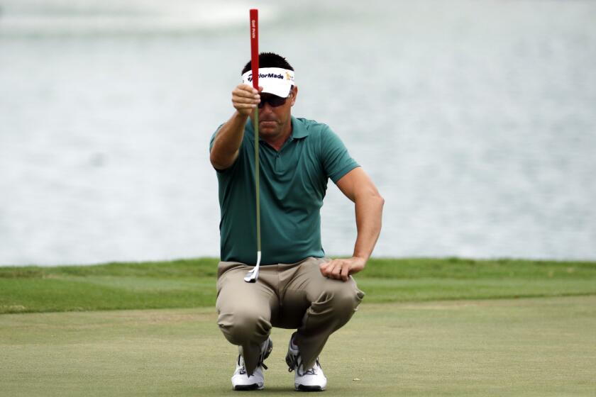 Robert Allenby lines up his ball at the Sony Open in Honolulu on Jan. 16.