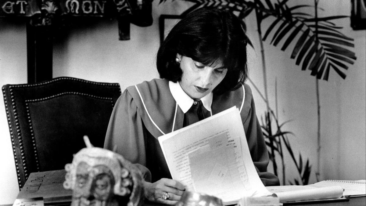Attorney Gloria Allred is shown in June 1984 at work in her West L.A. office.