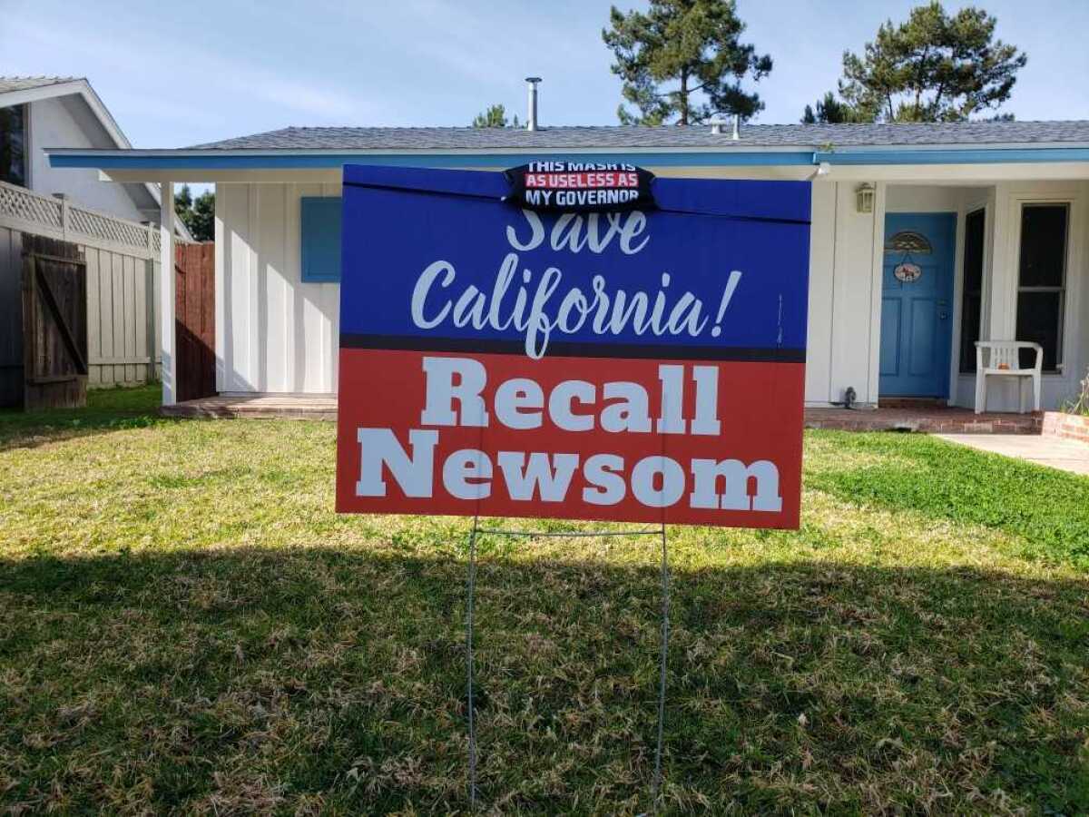 A yard sign says "Save California! Recall Newsom."