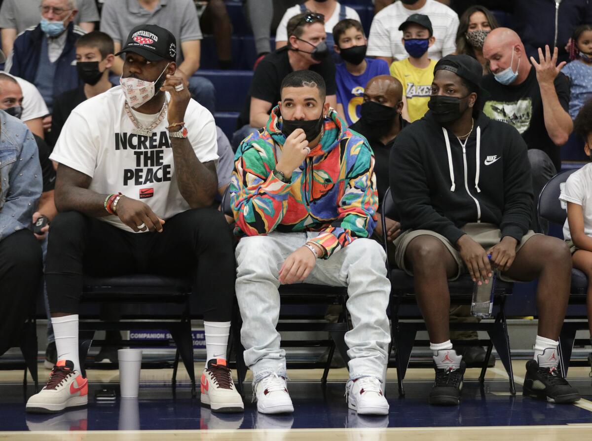 Lebron James, left, and Drake watch the Sierra Canyon Southern Section Open Division final.
