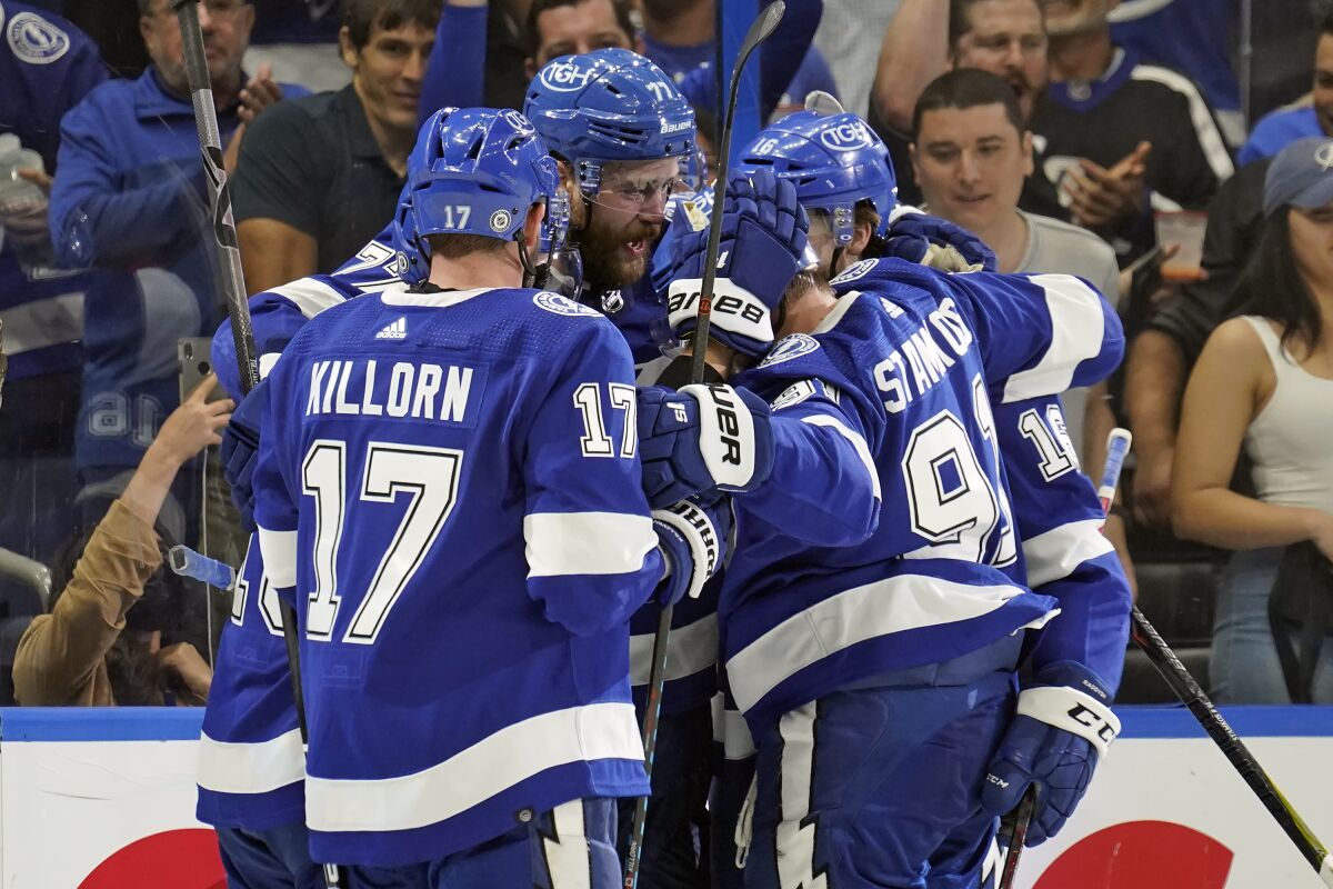 Tampa Bay Lightning defenseman Victor Hedman (77, center, celebrates his goal against the Ottawa Senators with left wing Alex Killorn (17) and center Steven Stamkos (91) during the second period of an NHL hockey game Thursday, Dec. 16, 2021, in Tampa, Fla. (AP Photo/Chris O'Meara)
