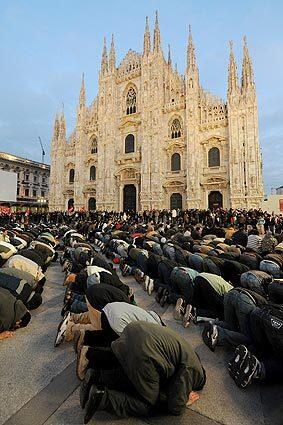 Praying after Gaza protest in Milan