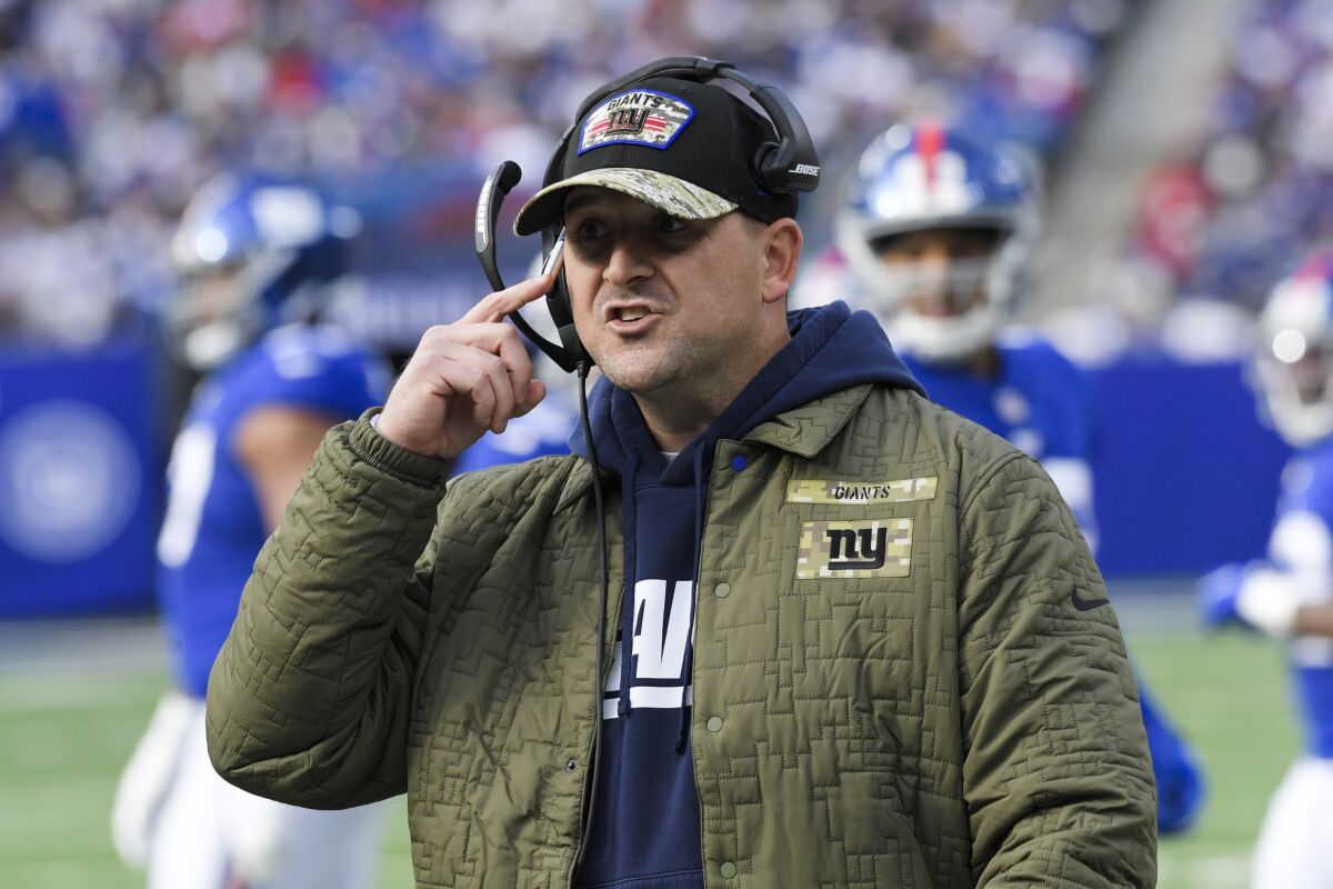 New York Giants head coach Joe Judge talks to players during the first half of an NFL football game against the Las Vegas Raiders, Sunday, Nov. 7, 2021, in East Rutherford, N.J. (AP Photo/Bill Kostroun)