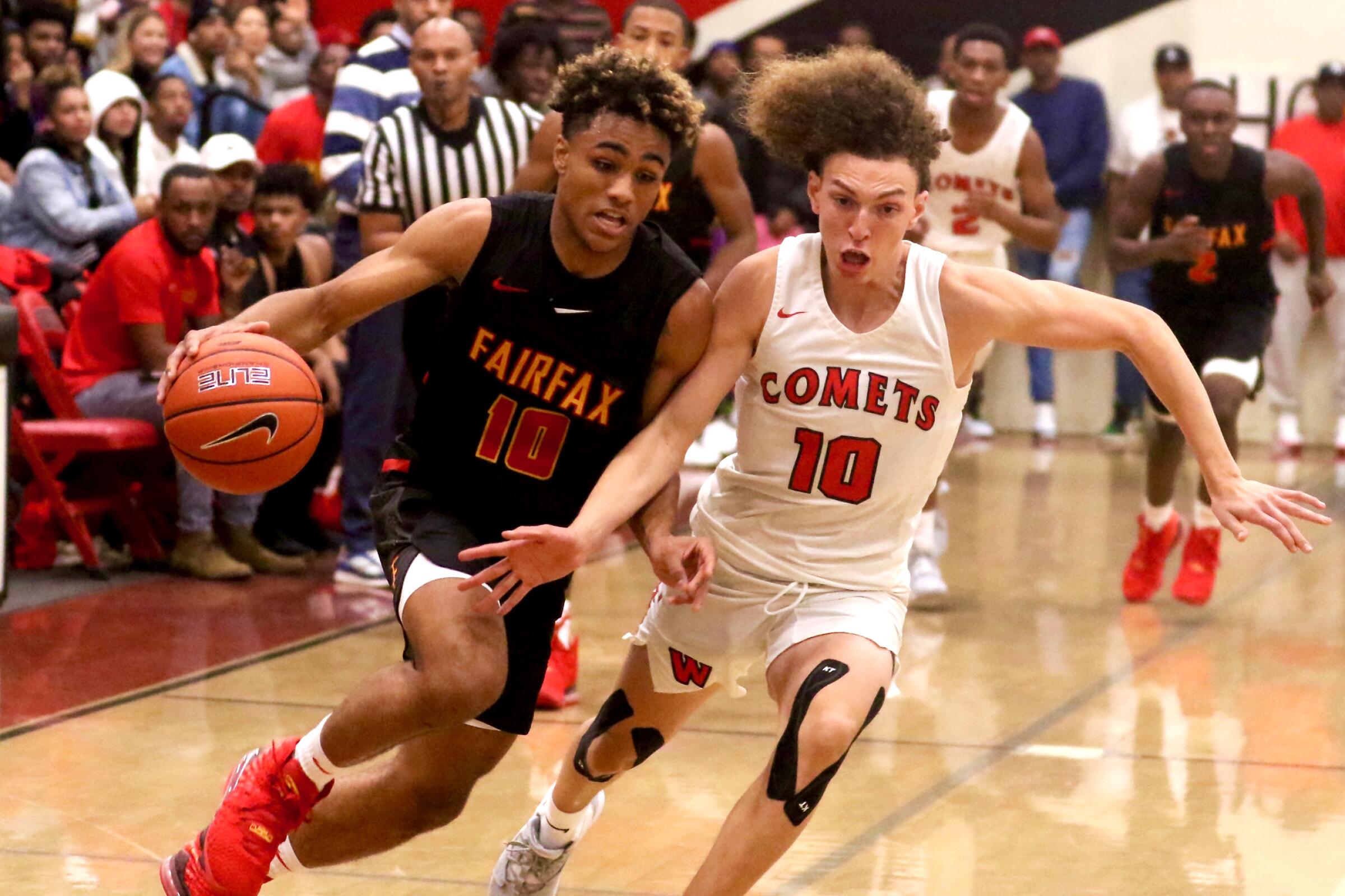Fairfax guard Spencer Dinwiddie drives against Westchester's T.J. Wainwright during their Western League game on Dec. 13, 2019.