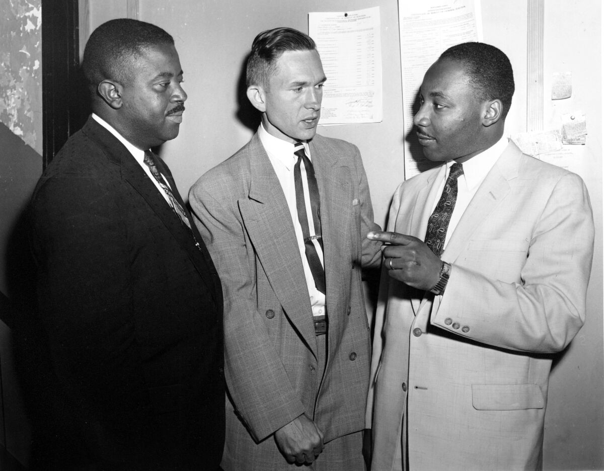 The Rev. Ralph Abernathy, left, Rev. Robert Graetz and Rev. Martin Luther King Jr. talk together.