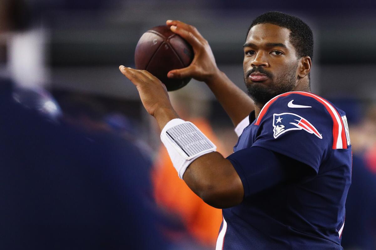 Patriots quarterback Jacoby Brissett (7) warms up on the sideline during the second half against the Houston Texans on Sept. 22.