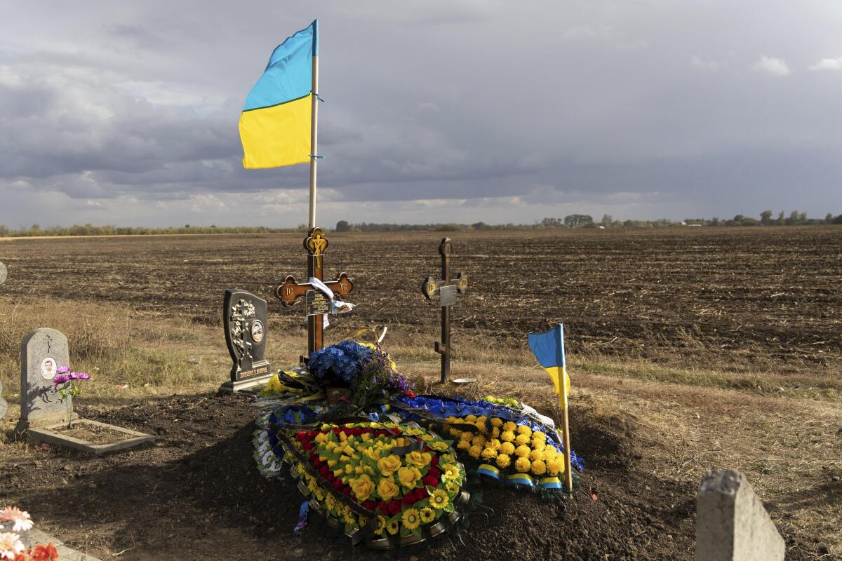 The grave of Ukrainian soldier Andrii Kozyr, who was reburied the day before, in the village of Hroza near Kharkiv, Ukraine.