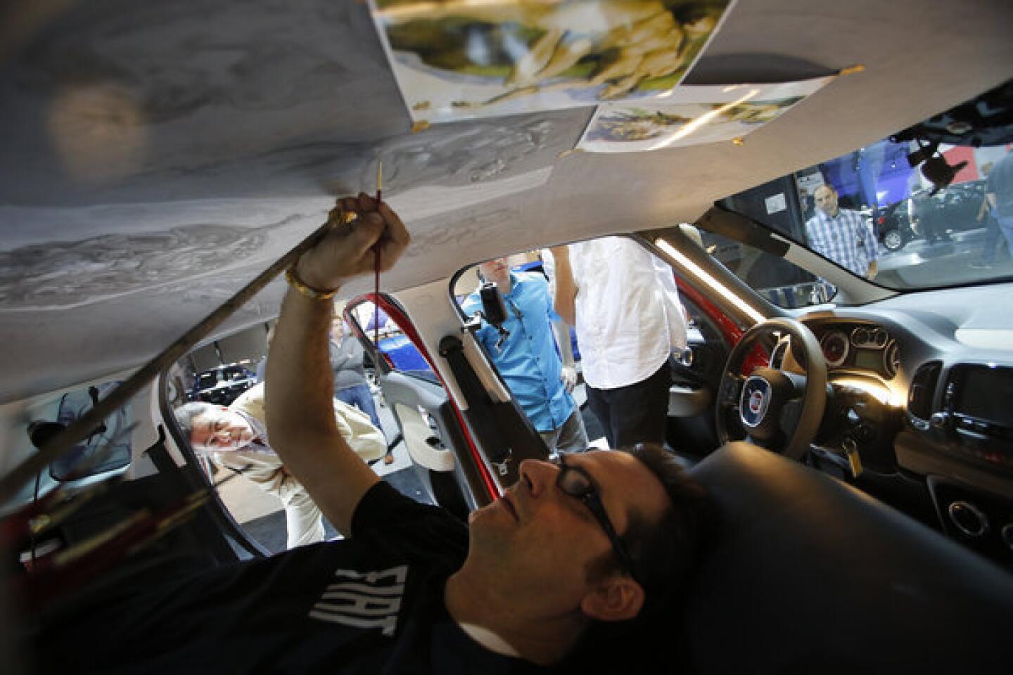 Car aficionados test-drive latest models at the L.A. Auto Show - Los  Angeles Times