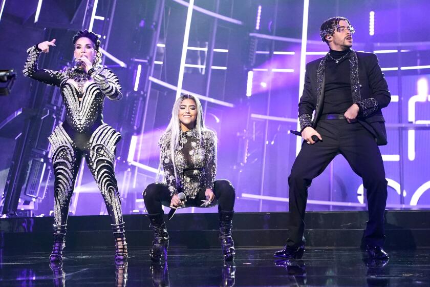 HOLLYWOOD, CA - OCTOBER 14, 2020: Ivy Queen, Nesi, and Bad Bunny perform "Yo Perreo Sola" during the 2020 Billboard Music Awards held at the Dolby Theatre in Hollywood, CA. (Andrew Gombert / Los Angeles Times)