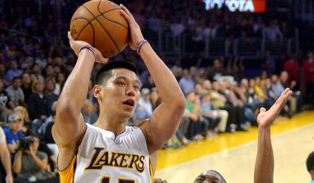 Lakers point guard Jeremy Lin pulls up for a short-range shot against the Hornets on Sunday.