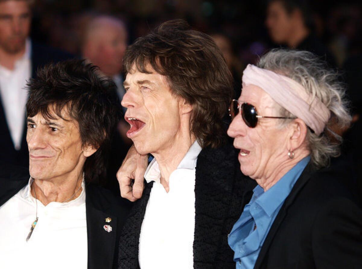 Rolling Stones guitarist Ronnie Wood, left, with Mick Jagger and Keith Richards, has sold off memorabilia in wake of his divorce from Jo Wood, his wife of 23 years.
