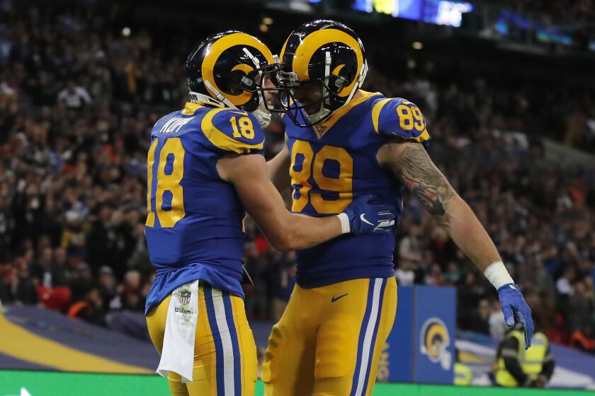 Rams receiver Cooper Kupp (18) congratulated by tight end Tyler Higbee (89) after scoring against the Bengals during a game Oct. 27 at Wembley Stadium.