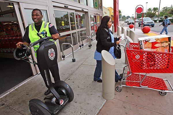 Assets protection specialist Terrell Gipson, 21, prepares to patrol the parking lot of the Compton Target store on a Segway. When it opened the store there in 2007, the company expected a higher risk of crime and took steps to address it: beefing up security and working with the city to get a sheriff's substation on site.