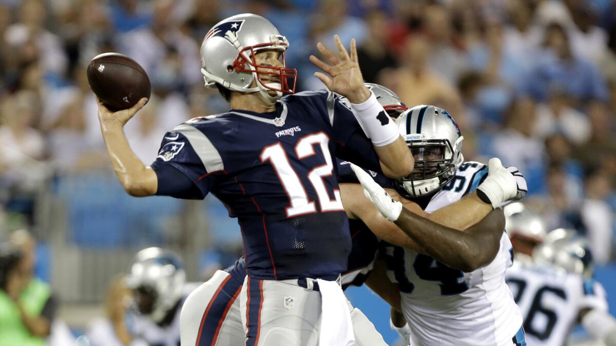 Patriots quarterback Tom Brady unleashes a pass against the Panthers on Friday night.