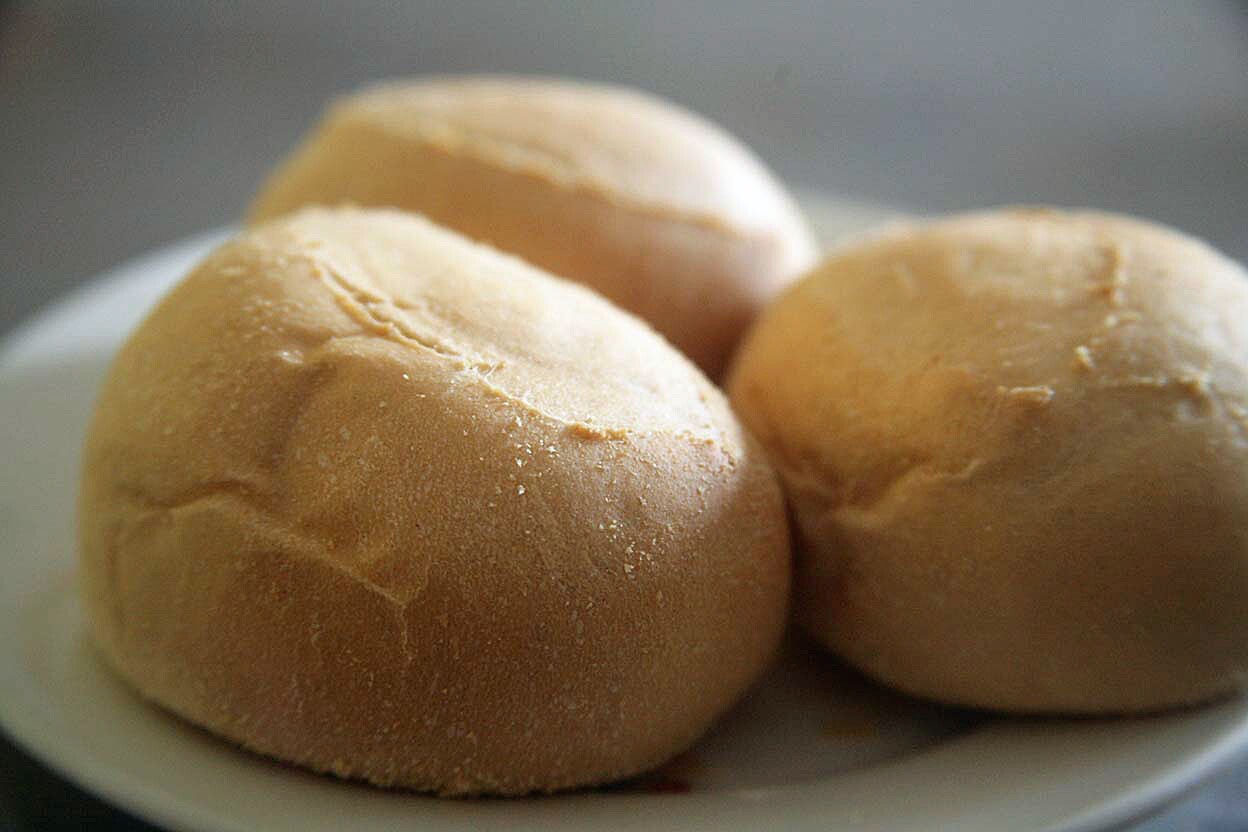 The pan de sal is soft and warm, served fresh from the oven several times a day.