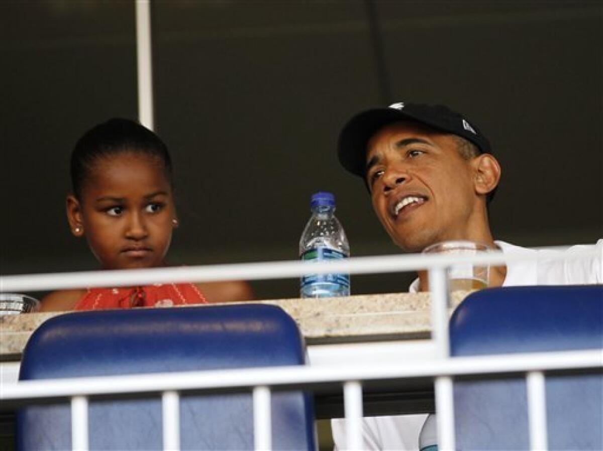 President Barack Obama, right, with his daughter Sasha, left, attend a interleague baseball game between the Chicago White Sox and the Washington Nationals Friday, June 18, 2010 in Washington.(AP Photo/Pablo Martinez Monsivais)
