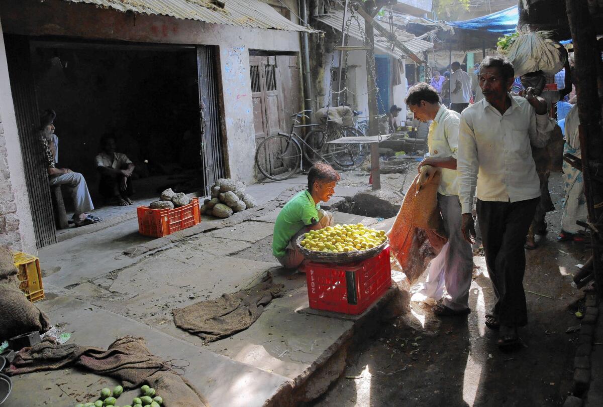 A vendor sells lemons at a market in Allahabad, India. Analysts say India isn’t creating nearly enough salaried jobs to absorb the 10 million young people entering its workforce each year.