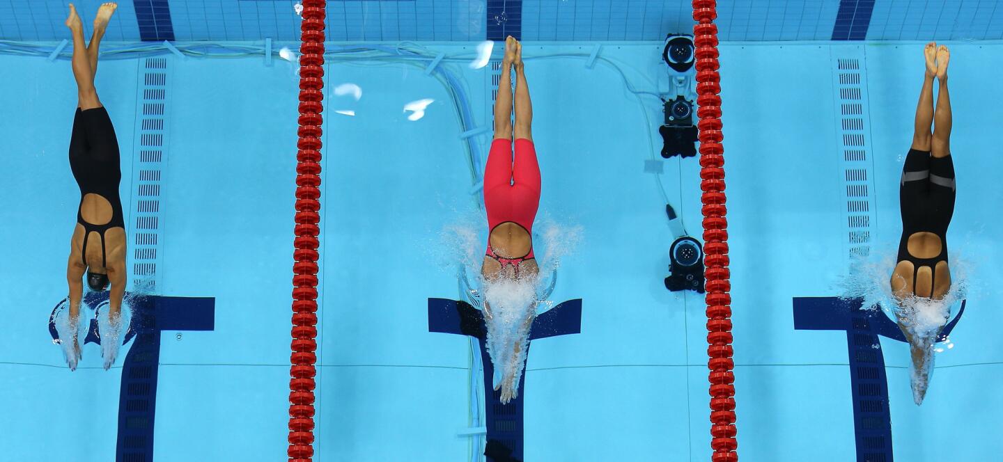 From left, Rikke Pedersen of Denmark, Rebecca Soni of the United States and Satomi Suzuki of Japan compete in the women's 200m breaststroke final.