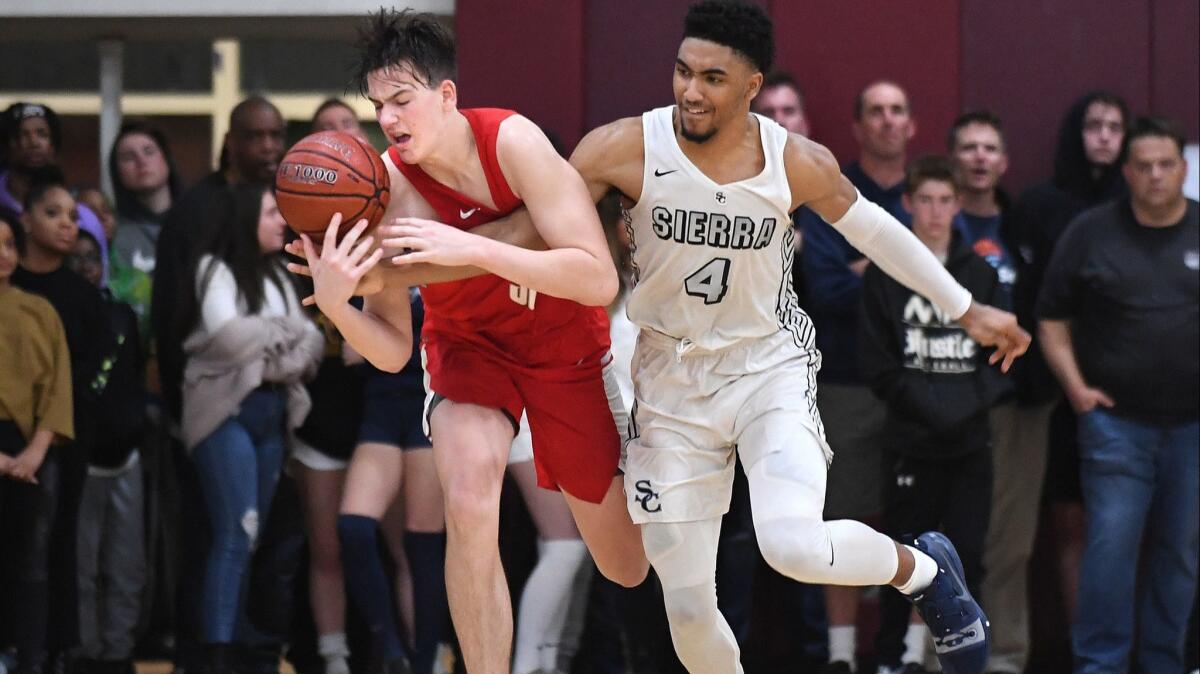 Sierra Canyon's Kenyon Martin Jr. knocks the ball away from Mater Dei's Jackson Hopps in the fourth quarter of the Southern California Regional Open Division final Tuesday at Simi Valley High.