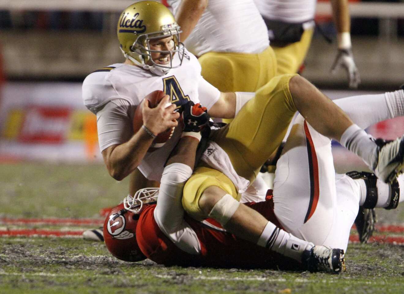 Bruins quarterback Kevin Prince is sacked by Utes linebacker Nai Fotu in the second half Saturday.