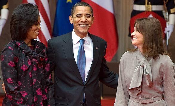 President Obama speaks with his wife, Michelle, and France's first lady, Carla Bruni-Sarkozy, at Palais Rohan during the NATO summit arrival ceremony in Strasbourg, France. The summit, which marks NATO's 60th year, is in Strasbourg and neighboring Baden-Baden and Kehl in Germany.