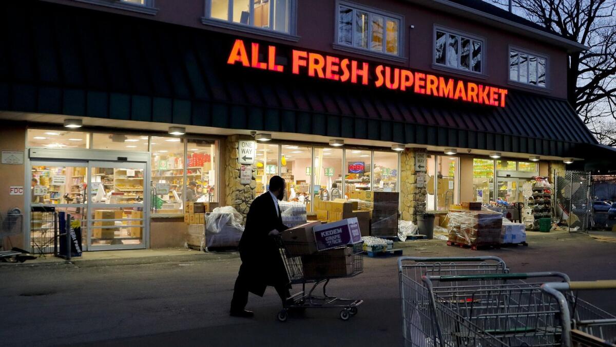 An Orthodox Jewish man walks through a parking lot in Spring Valley, N.Y. Rockland County's measles outbreak has most heavily affected Orthodox Jewish communities, in which vaccination rates tend to be lower.