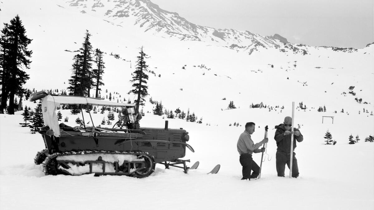 California Department of Water Resources workers conduct a Sierra snowpack survey in El Dorado County in 1958. The measuring methods haven't changed much since then. (California Department of Water Resources)