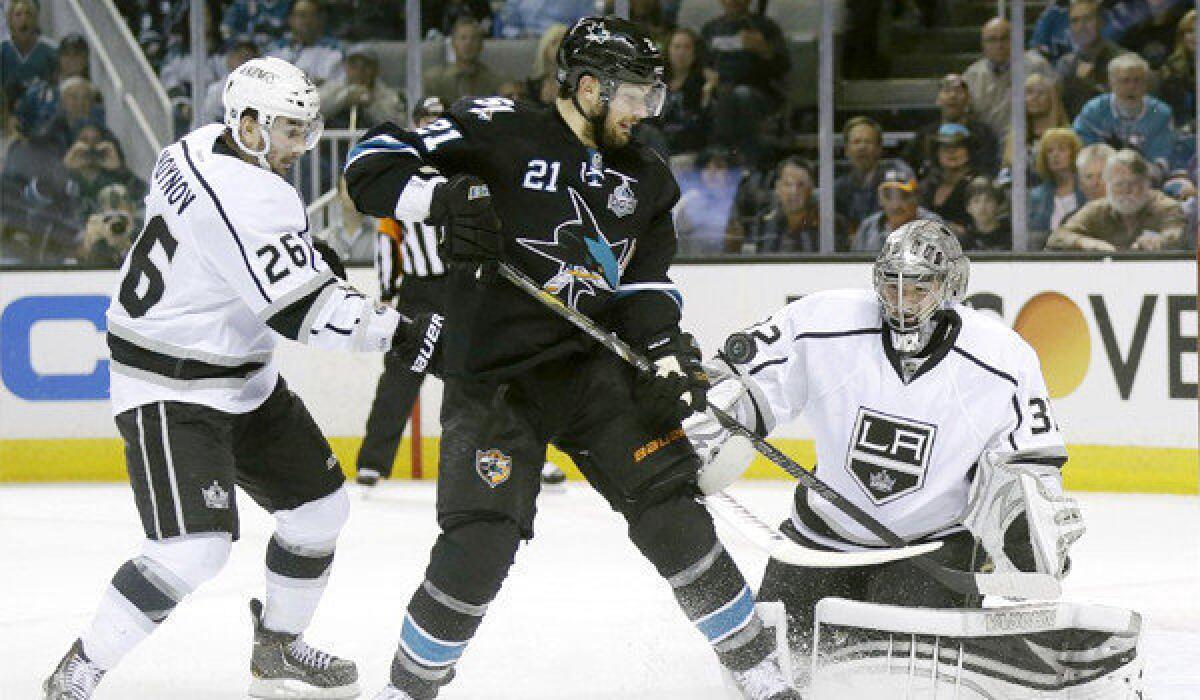 T.J. Galiardi's shot is knocked down by Jonathan Quick during Game 4 of the Kings' Western Conference semifinal matchup with the San Jose Sharks on Tuesday.