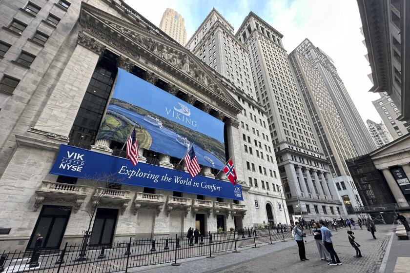 A banner for cruise operator Viking, marking its initial public offering, hangs on the front of the New York Stock Exchange on Wednesday, May 1, 2024 in New York. (AP Photo/Peter Morgan)