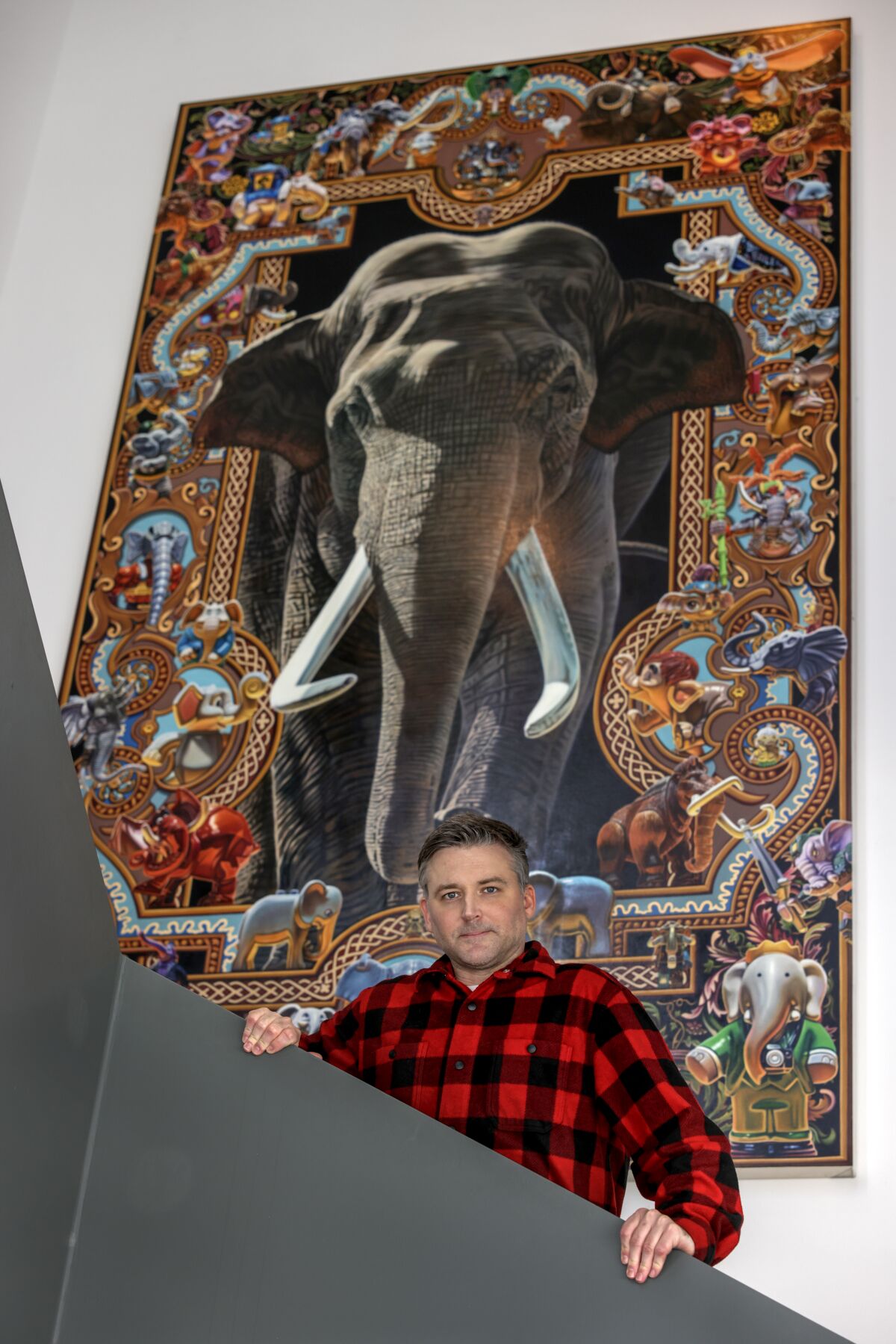 Artist Robert Xavier Burden with his "The Elephant Painting" t the Oceanside Museum of Art.
