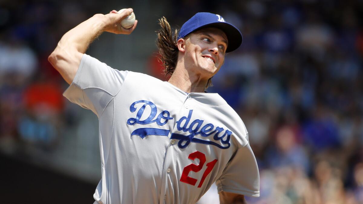 Dodgers starter Zack Greinke delivers a pitch during the first inning of Sunday's game against the New York Mets.