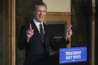 California Gov. Gavin Newsom speaks about mental health crisis before signing off on two major pieces of legislation to transform the state's mental health system and to address the state's worsening homelessness crisis in Los Angeles, Thursday, Oct. 12, 2023. (AP Photo/Damian Dovarganes)