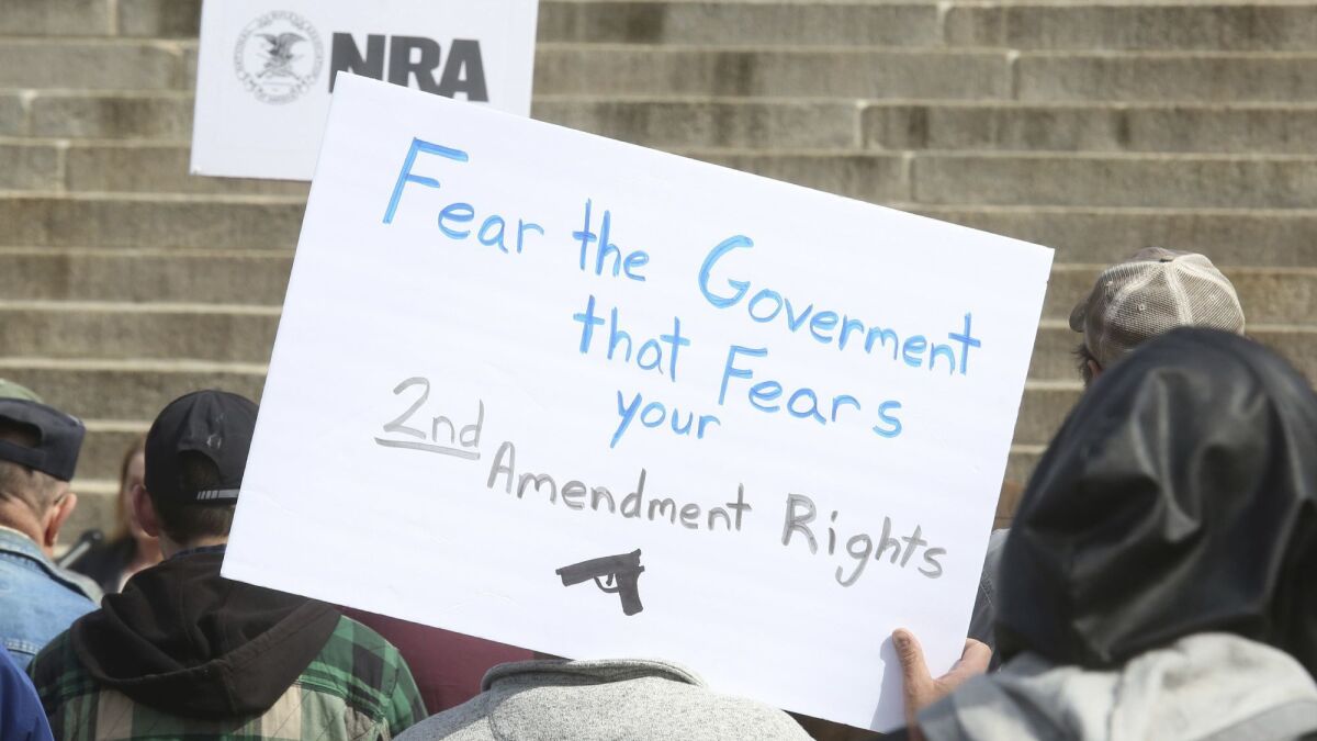 People gather in April for a 2nd Amendment rally on the steps of the Kansas Statehouse.