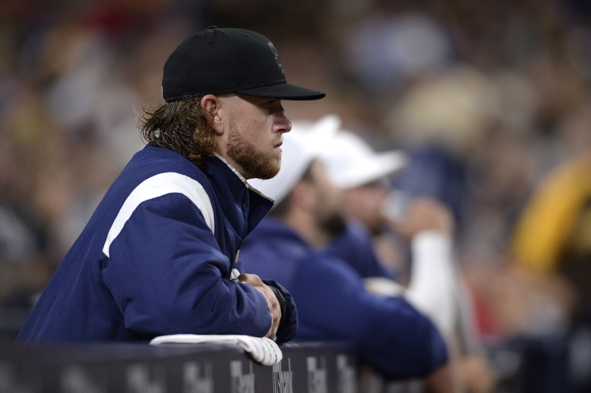 Padres rookie pitcher Chris Paddack looks on from the dugout after being pulled from Saturday's game against the Boston Red Sox.
