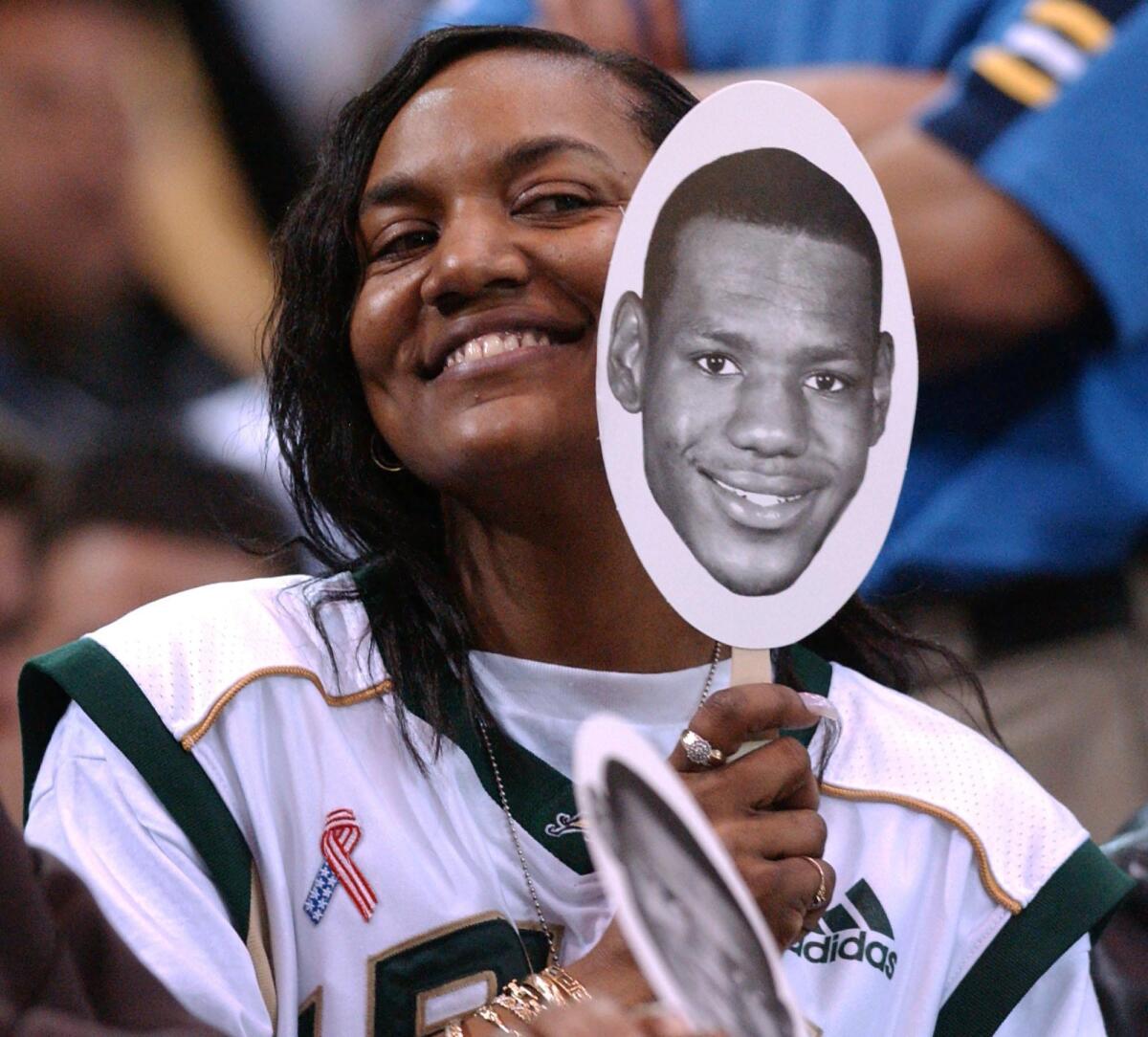 LeBron James' mother Gloria James, showing her support for James when he was still a high school player. His St. Vincent-St. Mary school was playing Southern California's Mater Dei on January 2003. St. Vincent-St. Mary won 64-58 with James scoring 21 points.