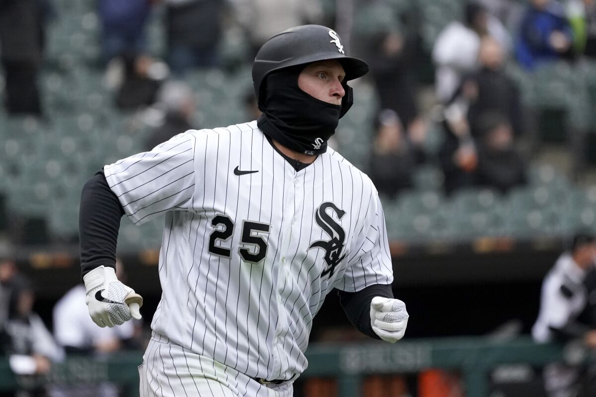 Chicago White Sox's Andrew Vaughn rounds the bases after hitting a three-run home run off Kansas City Royals relief pitcher Scott Barlow during the seventh inning of a baseball game Wednesday, April 27, 2022, in Chicago. (AP Photo/Charles Rex Arbogast)