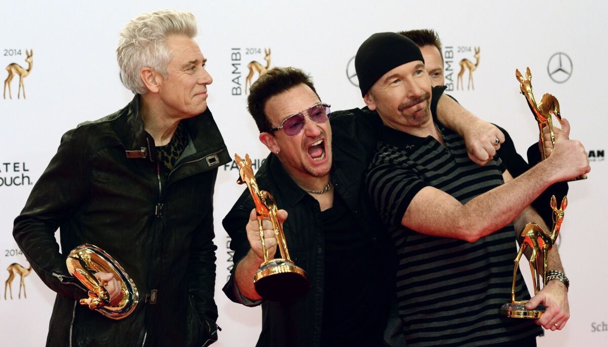 Members of U2, shown at an awards ceremony in Berlin in November, cheered news that people who received their "Songs of Innocence" album unrequested on Apple iOS devices last year were still listening to the music in January.