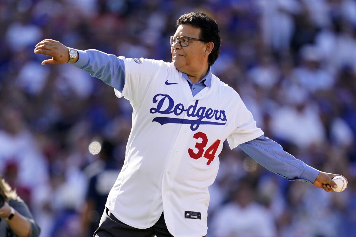 Dodgers great Fernando Valenzuela throws the ceremonial first pitch at the MLB All-Star Game.