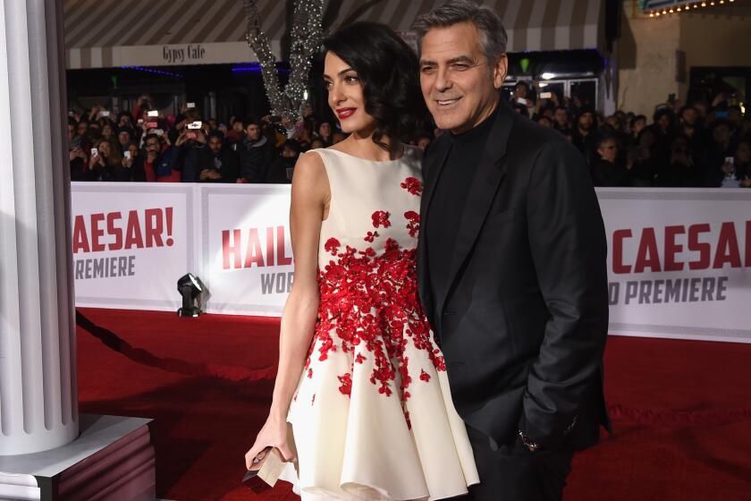 Actor George Clooney and his wife, Amal Clooney, attend Universal Pictures' "Hail, Caesar!" premiere at Regency Village Theatre on Monday in Westwood.