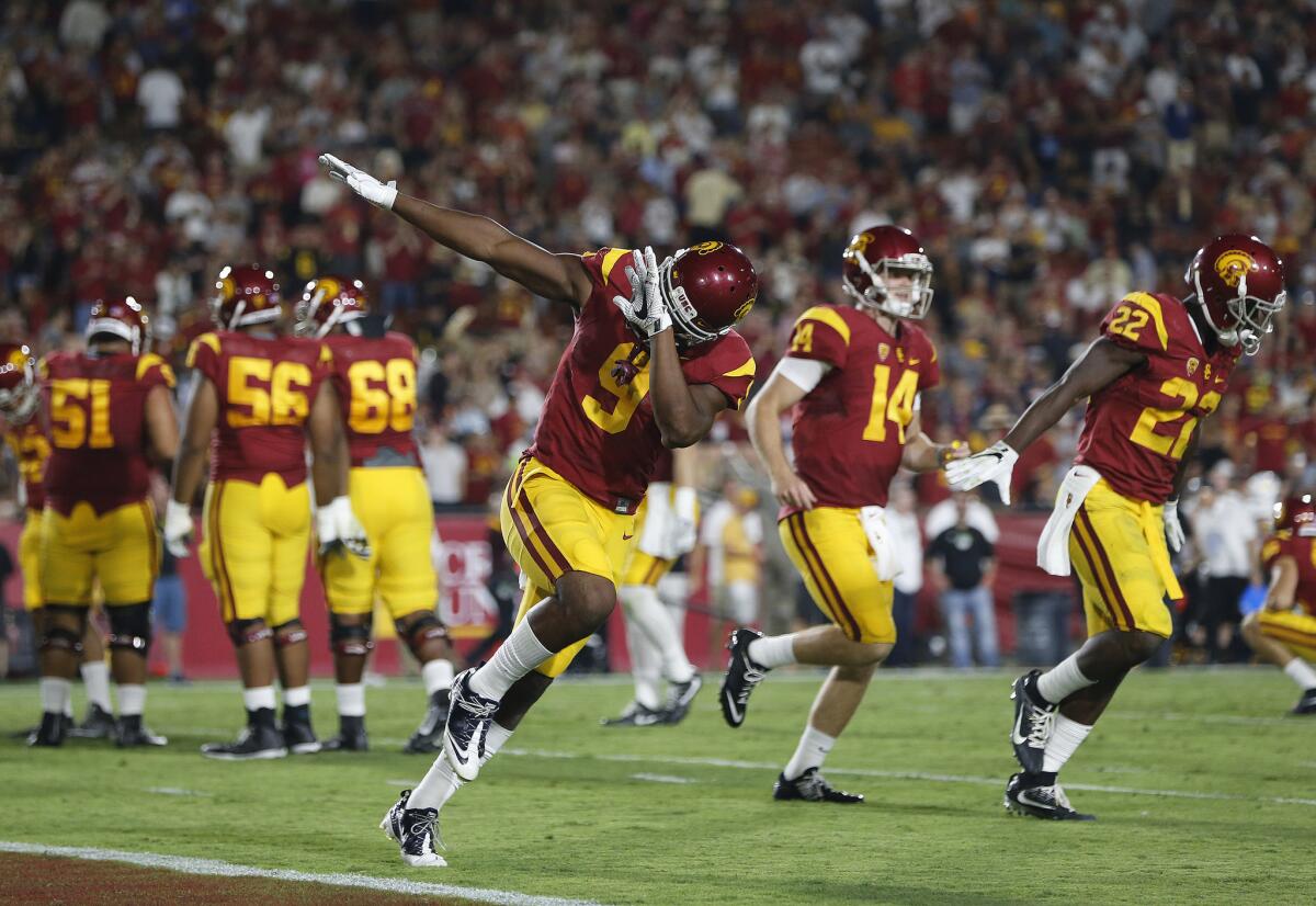 USC receiver JuJu Smith-Schuster (9) reacts after scoring a touchdown against Arizona State during the first half of a game at the Coliseum on Oct. 1.