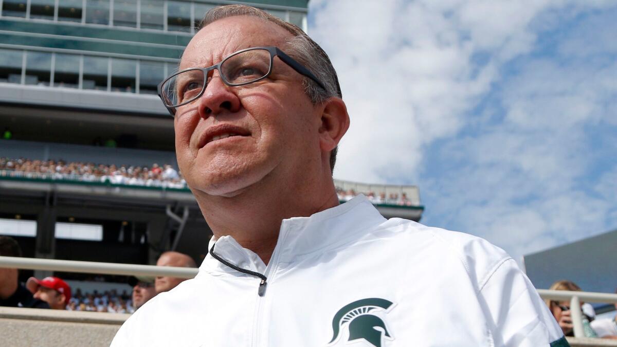 Michigan State University athletic director Mark Hollis watches a Spartans football game against Wisconsin on Sept. 24, 2016.