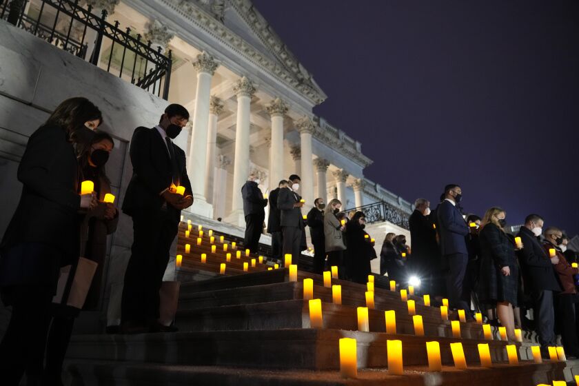 WASHINGTON, DC - JANUARY 06: Members of Congress and staff participate in a prayer vigil on the East Front of the U.S. Capitol on January 06, 2022 in Washington, DC. One year ago, supporters of President Donald Trump attacked the U.S. Capitol Building in an attempt to disrupt a congressional vote to confirm the electoral college win for Joe Biden. (Photo by Drew Angerer/Getty Images)