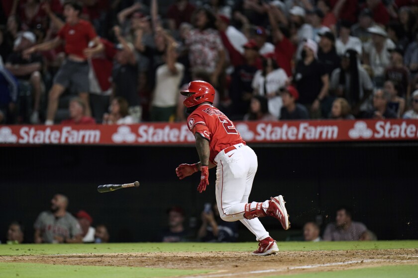Luis Rengifo throws his bat after hitting a two-run double for the Angels in the eighth inning on Saturday.