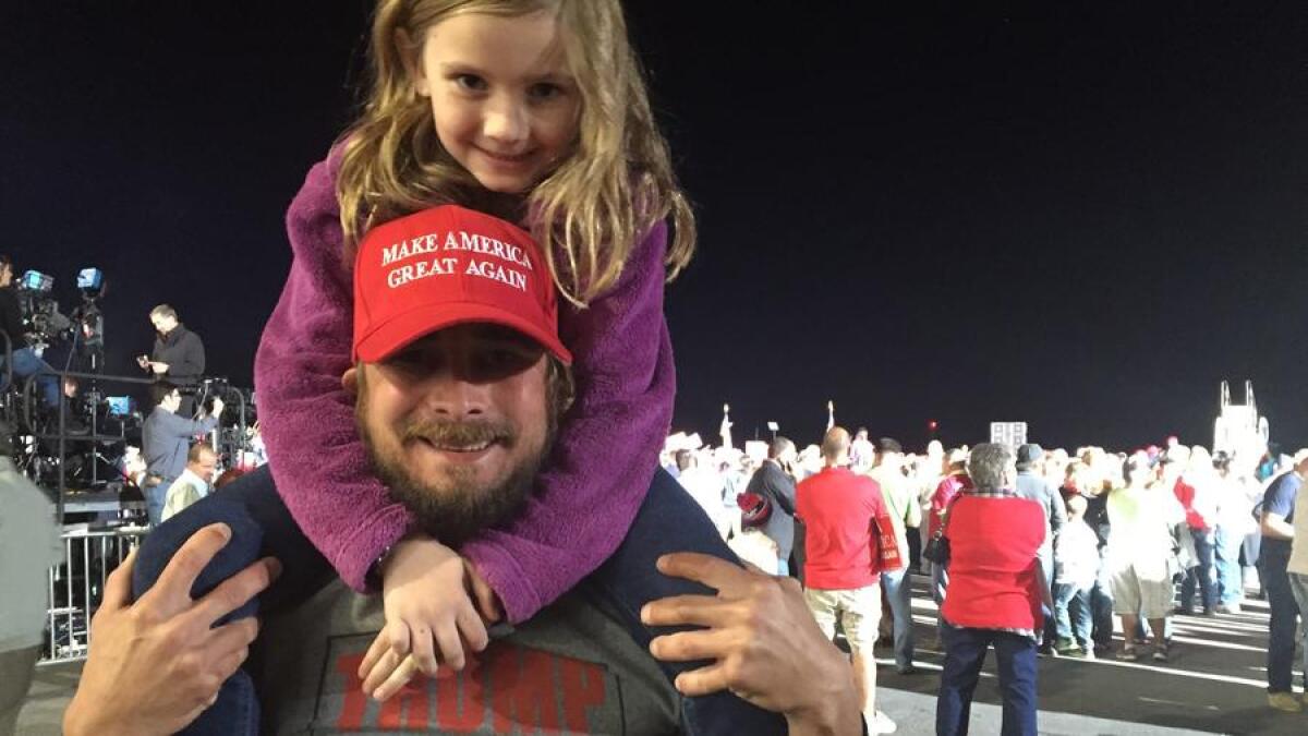 Justin Smith attends a Donald Trump rally in Kinston, N.C., with his daughter, Ella Lynn, 7.