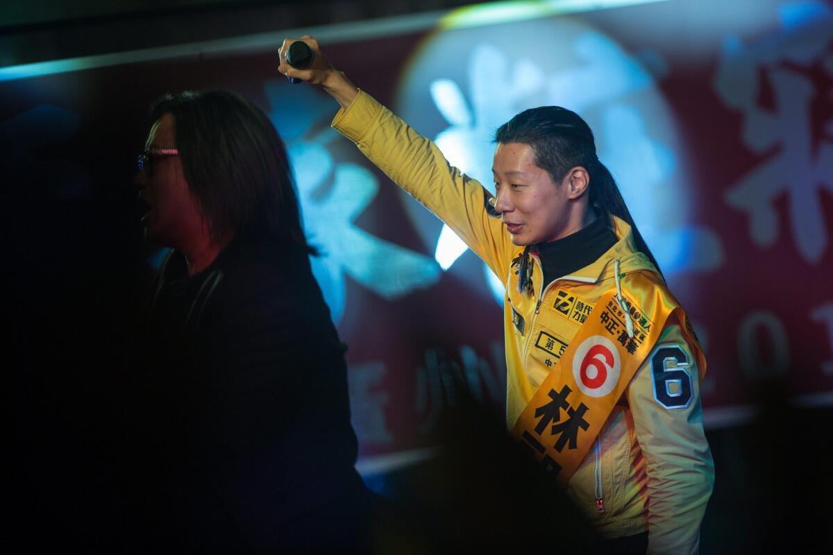 The founder of the New Power Party and lead vocalist of the Taiwanese heavy-metal band Chthonic, Freddy Lim, attends a rally in Taipei on Jan. 14, 2016. Lim, whose "black metal" band has been dubbed the Black Sabbath of Asia, won a legislative seat in Taipei City.