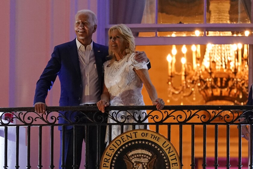 President Joe Biden and first lady Jill Biden view fireworks during an Independence Day celebration on the South Lawn of the White House, Sunday, July 4, 2021, in Washington. (AP Photo/Patrick Semansky)